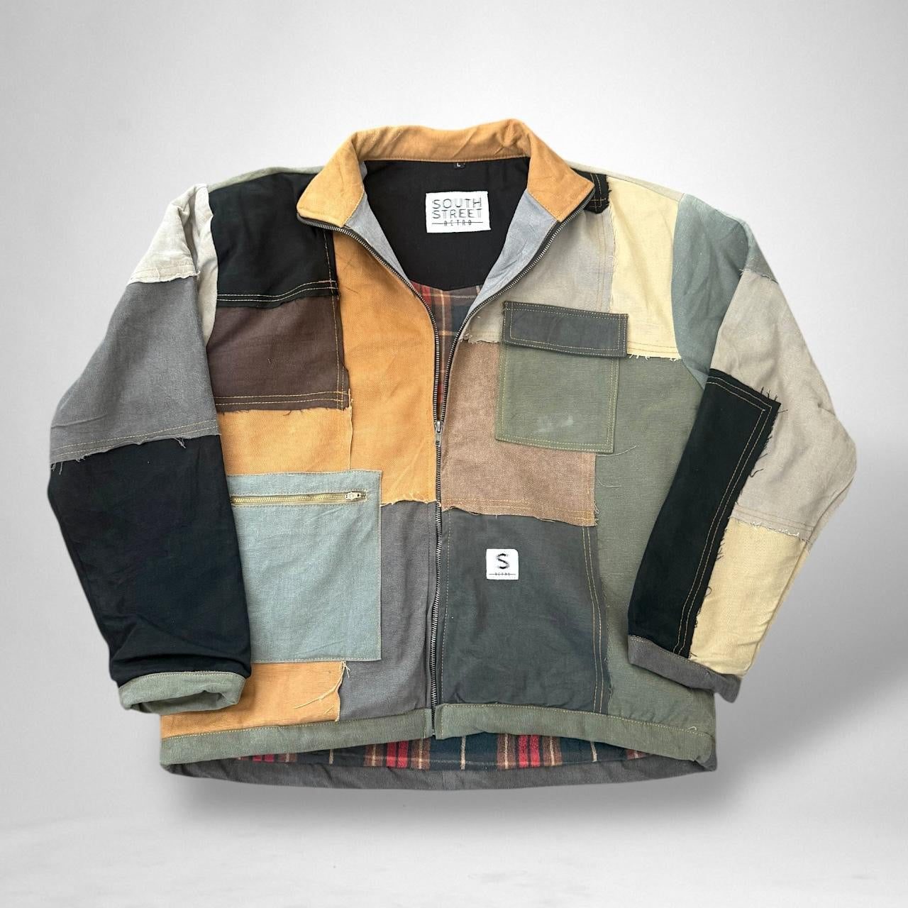 Retro patchwork reworked jacket from South Street featuring vintage 90s upcycled streetwear design