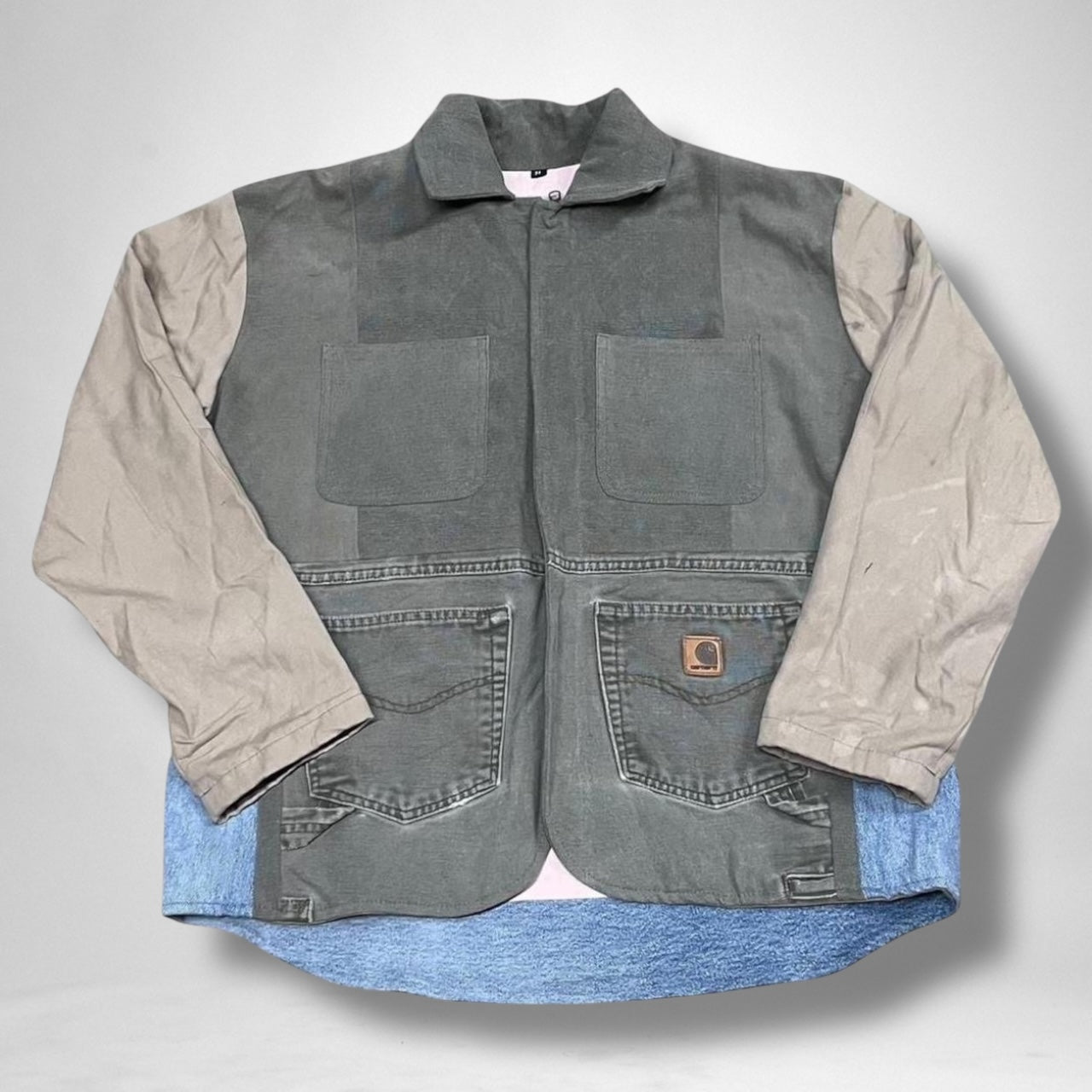 Reworked Carhartt jacket combining vintage utility construction with modern streetwear style.