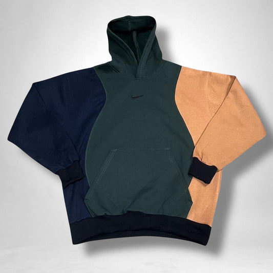 Reworked Nike hoodie in navy, khaki, and brown with vintage patchwork design and streetwear style