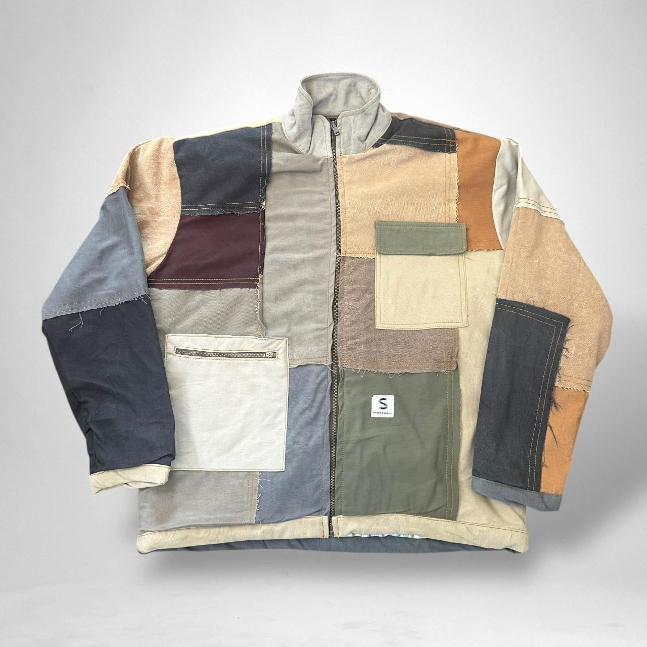 Upcycled patchwork South Street Retro jacket featuring vintage 90s streetwear style and handcrafted sustainable design