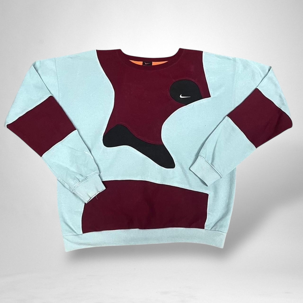 Crafted for comfort and style, the jumper includes the iconic Nike logo, carefully preserved and re-positioned to complement the new color layout. With its oversized fit and premium cotton-blend fabric, this piece delivers both cozy wearability and eye-catching aesthetics.