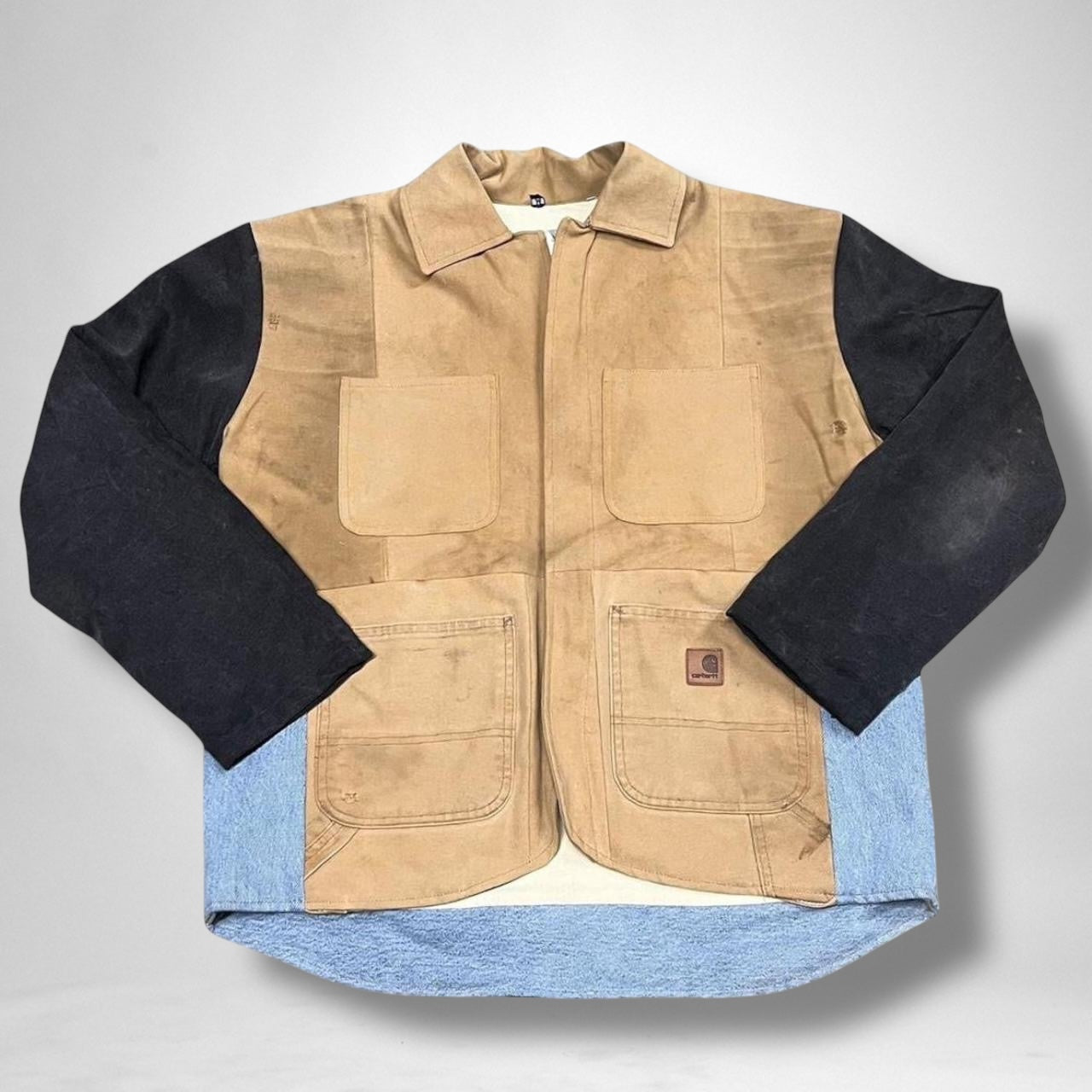 Reworked vintage Carhartt jacket with custom streetwear design and unique detailing.