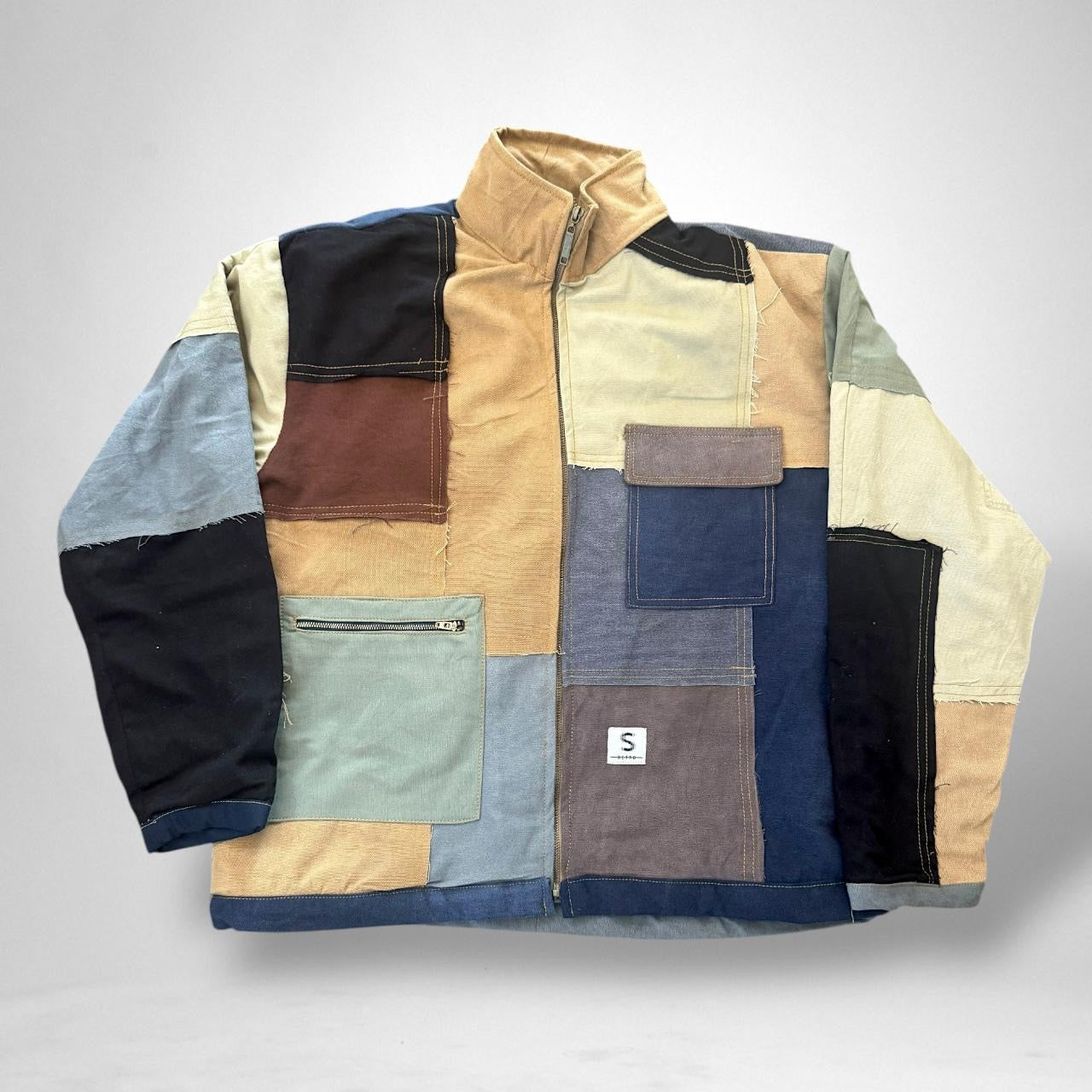 Reworked vintage patchwork jacket with South Street Retro 90s style, featuring sustainable upcycled design and bold streetwear elements