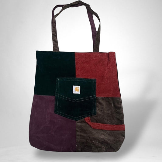 Upcycled Carhartt tote bag made from repurposed canvas workwear, featuring sturdy handles and a spacious design for everyday use